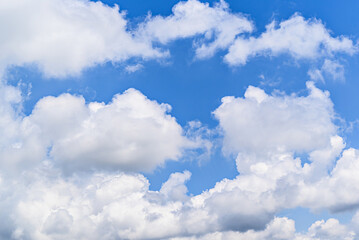 White clouds in a bright blue sky. The beauty of the nature