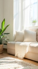 A sunlit living room with a cozy sofa, white pillows, and lush green plants, creating a serene and inviting atmosphere.
