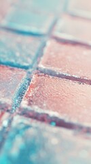 Fototapeta premium A close-up of a tiled surface with pastel-colored hues, capturing the texture and subtle color variations in an abstract composition.
