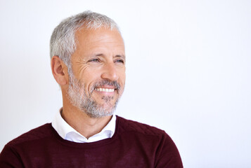 Thinking, idea and face of business man in studio for problem solving, brainstorming and solution. Professional, corporate worker and mature on white background for career space, job and inspiration