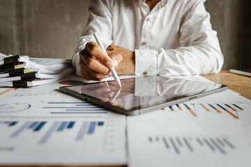 Businessman analyzing financial data with fine art fonts, reflecting investment strategies, market trends and economic growth, with an emphasis on wealth management, income and risk planning.”