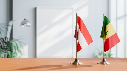 FLAGS OF AUSTRIA AND SENEGAL ON TABLE