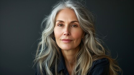 Naklejka premium Graceful Elderly Woman with Long Gray Hair Portrait