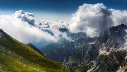 Naklejka premium clouds over mountain alps