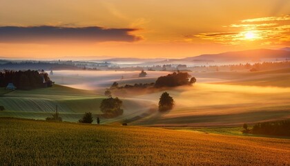 majestic foggy sunrise over colorful farmland and countryside
