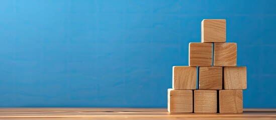 Conceptual special order symbol shown on wooden blocks against a blue backdrop with copy space image available