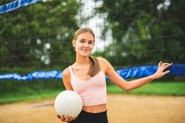 teen play beach volleyball in summer season