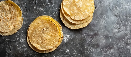Mexican tortillas on a concrete surface with ample copy space image