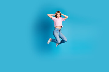 Full length photo of lovely young lady jumping excited crazy dressed stylish striped pink garment...