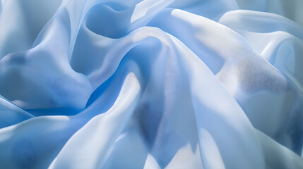 Obraz premium Soft sky blue fabric with gentle folds and shadows creating a serene and tranquil atmosphere perfect for backgrounds or textile designs
