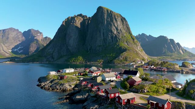 Hamnoy fishing village on Lofoten Islands Norway showcases vibrant fisherman cabins against a dramatic mountain backdrop, ideal for travel enthusiasts and adventurers