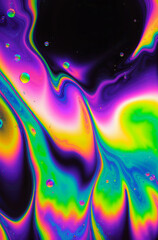 Vibrant iridescent abstract liquid swirl with rainbow colors and bubbles, futuristic digital art concept, website header with copy space for creative industries and digital design, dark background,