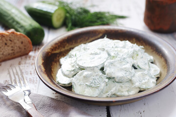 A traditional Polish salad Mizeria in rustic style