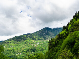 Obraz premium gray clouds over overgrown mountains in Caykara