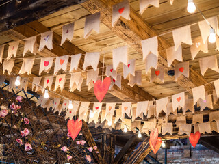 flags under village house ceiling in Kaliningrad