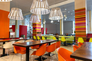 Modern restaurant interior with bright red and green design