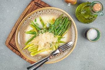 Asparagus salad with cheese on plate. Long banner format. top view. copy space for text
