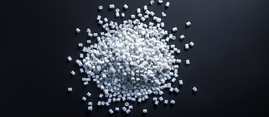 Virgin plastic granules isolated on a black background for an industrial product catalog banner design featuring copy space image