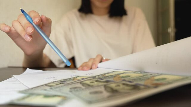 A young woman thinks and hesitates about a money loan.