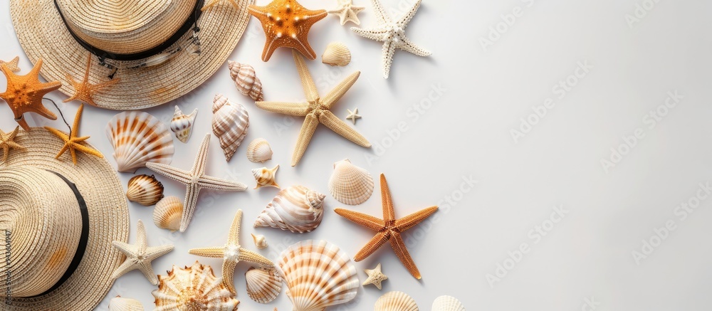 Poster flat lay top view of summer beach dress accessories such as shells starfish sunglasses and straw hat