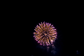 Fireworks on the dark sky background. Colorful fireworks from Loto Quebec in Quebec city, Canada. Abstract colored firework background with free space for text. fireworks light up the night sky