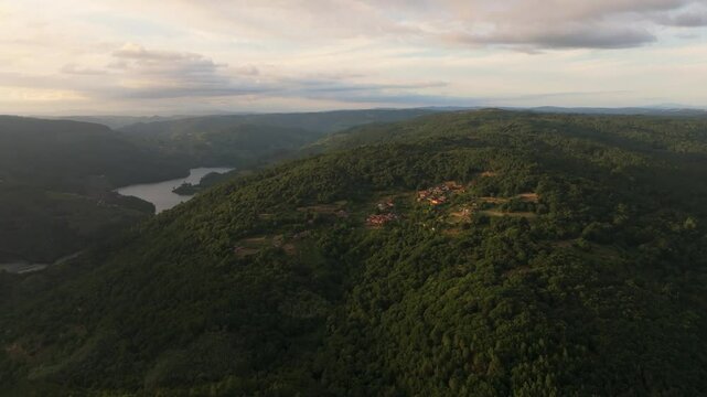 Mountain Village Of Marce With Minho River In Background. Panton, Lugo, Spain. aerial shot