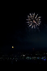 Fireworks on the dark sky background. Colorful fireworks from Loto Quebec in Quebec city, Canada. Abstract colored firework background with free space for text. fireworks light up the night sky