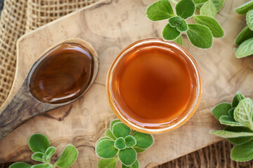 A bowl of Coleus amboinicus syrup for common cold, top view