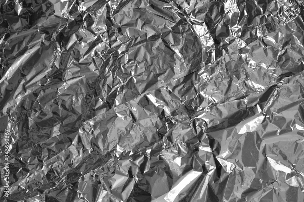 Wall mural processed collage of shiny metal silver gray foil crumpled packaging material texture