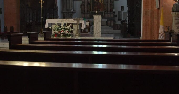 Quiet prayer time at a local church with elegant altar setup and peaceful surroundings during the evening