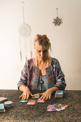 Tarot reader engrossed in her cards, ready to share insights and guidance
