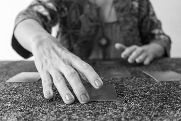 Tarot reader presenting the cards, poised to uncover the secrets they hold