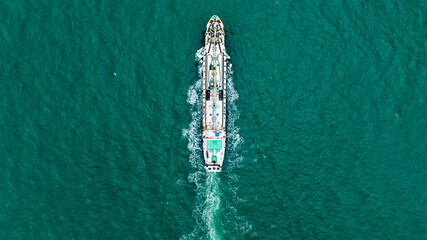 oil tank container ship in middle green sea, for import export aerial top view © SHUTTER DIN