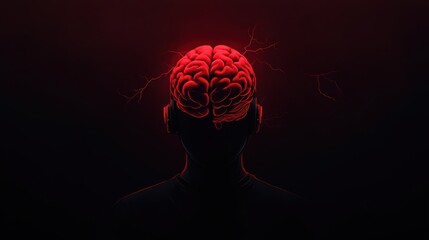 Obraz premium A striking silhouette of a head showcasing a red illuminated brain, symbolizing creativity and cognitive power.
