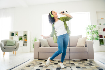 Photo of cheerful adorable lovely girl dance sing have fun comfortable apartment flat living room...