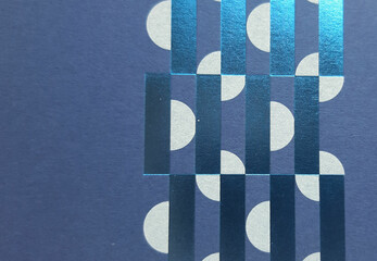 abstract navy blue paper texture with geometric elements printed in white and blue metallic, close-up textured background, beautiful wallpaper, cover or banner with space for design