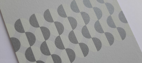 abstract white paper texture with circles printed in white and silver, close-up textured background, beautiful wallpaper, cover or banner with space for design