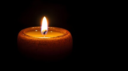 A single candle burning brightly in the midst of darkness its flickering flame casting a warm inviting glow and symbolizing the power of inner reflection