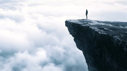 A person stands with determination at the edge of a towering cliff symbolizing the courage to face life s challenges and embrace new adventures