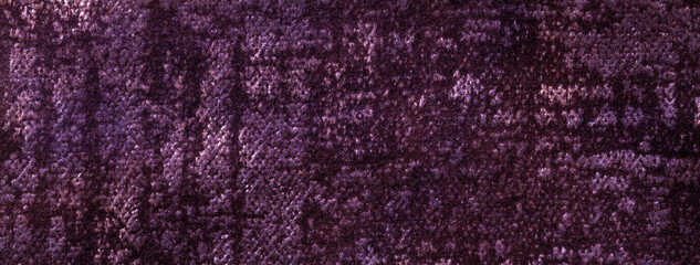 Texture of velvet dark purple background from soft upholstery textile material, macro. Abstract velour violet fabric