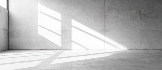 Fototapeta premium White blank sheet on a light gray textured cement or concrete wall background Copyspace Mockup or template for contemporary design with copyspace