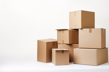 Boxes stacked in a random arrangement on a white background, ideal for shipping, storage, or moving purposes