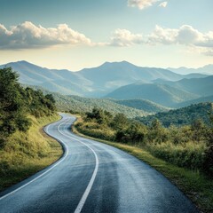Scenic mountain road winding through lush green hills under a beautiful sky, perfect for nature lovers and travel enthusiasts.