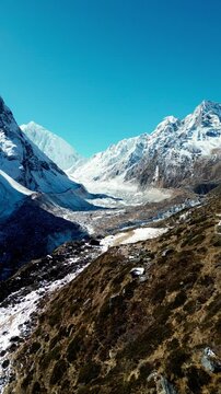 Aerial footage of huge glacier and mountains on the way to Dharamsala village, Nepal, Himalayas