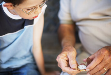 Boy Looking at Man's Pocket Watch