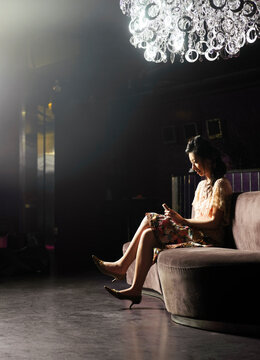 Woman Sitting in Club