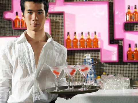 Waiter Holding Tray of Martinis
