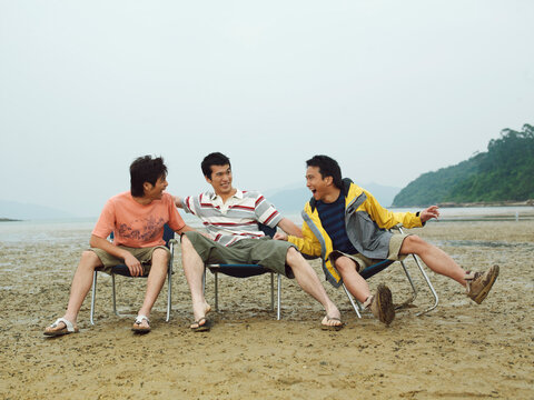 Men Goofing Around on the Beach