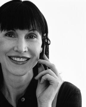 Portrait of Businesswoman Using Telephone Headset