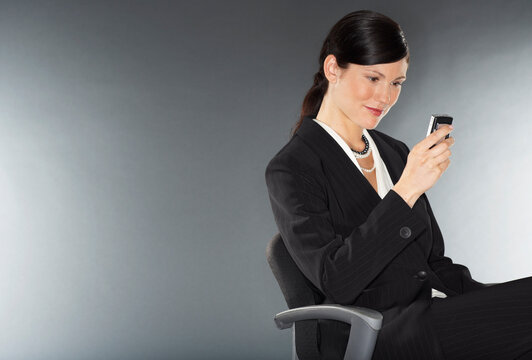Businesswoman Reading Text Message